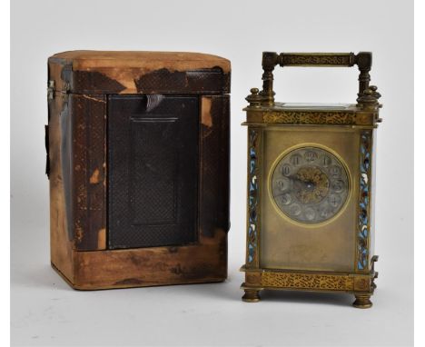 A late 19th century brass carriage clock with travel case. The silvered dial inscribed Henry Wells and having Arabic numerals