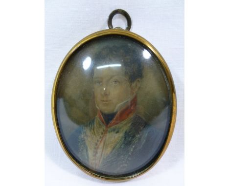 An 19th century oval portrait miniature of a gentleman, wearing a blue coat, 7.4cm x 5.8cm, housed in brass mount CONDITION R