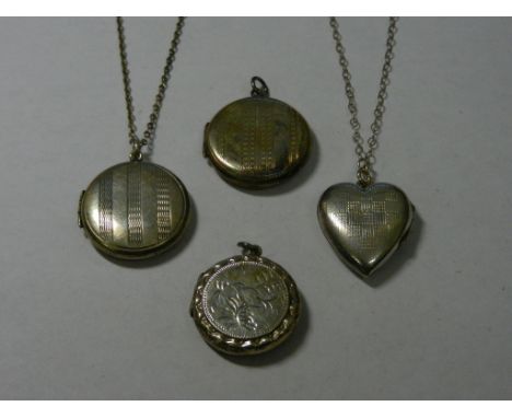 Two circular engine turned lockets, 24mm diameter, and a heart-shaped locket with engine turned decoration, all stamped 'SILV