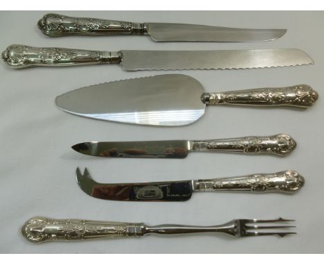 Six silver handled kings pattern flatware items, comprising a bread knife, cake knife, pie slice, cheese knife, grapefruit kn
