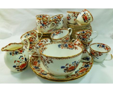 A Copeland China part tea service comprised of a sugar bowl and cream jug, 14 cups and saucers, 11 side plates and two cake p