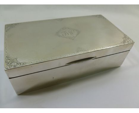 A George V rectangular silver cigarette box wtih engine turned decoration, Birmingham 1928, with wooden interior, 5cm x 9cm x