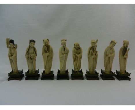 A set of eight early 20th Chinese century carved ivory figures of immortals, ech mounted on a carved hardwood stand with pier