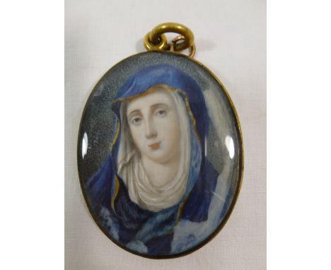 An 18th century oval portrait miniature on ivory of the Virgin Mary, signed Downes and dated 1766, 5.8cm x 4.5cm in gilt meta