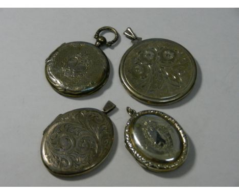 A Victorian circular silver locket with chased and engine turned decoration, 30mm diameter and three other later oval and cir