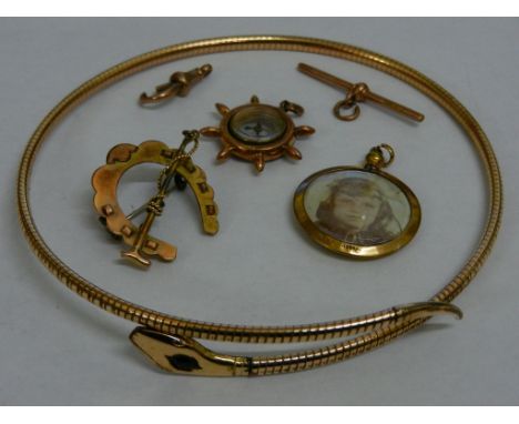 A Victorian rolled gold snake choker with gem set head, stamped 'Rolled Gold Made in Baden', a 9 carat gold horseshoe brooch,