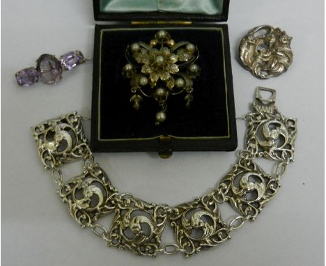 A Norwegian .830 standard silver bracelet with six square openwork scroll cast links, maker's mark 'E' in cartouche, an ameth