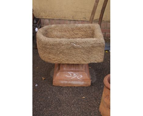 A 19th century hewn stone D ended pump trough, with central drain hole, 64cm long