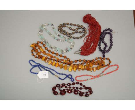 A lapis lazuli bead necklace, an enamelled bead necklace, an amethyst bead necklace and six further beaded necklaces