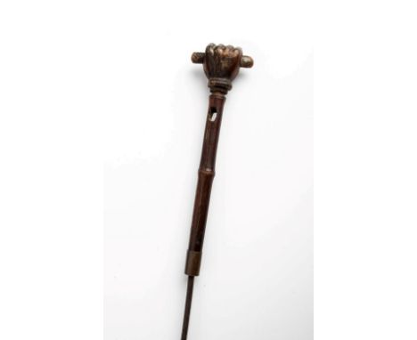 A 19th century carved tortoiseshell 'Fist of Friendship' pommelled bamboo sword stick, the square section rod blade with simp