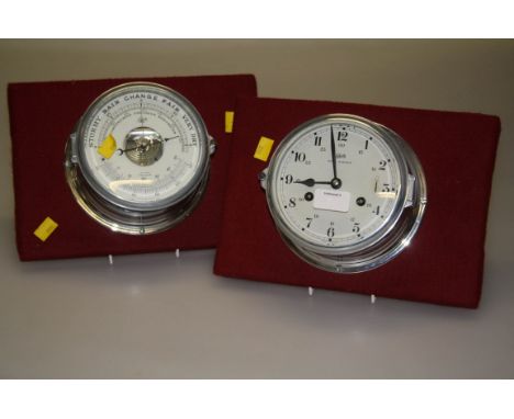 A Makeling barometer/thermometer, with chrome body, 17cm diameter, together with a similar bulk head clock (2)
