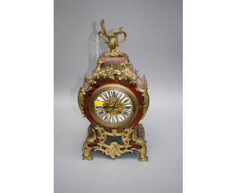 A late 19th century French Boulle and ormolu mounted mantel clock, the shaped balloon case enclosing an eight-day movement nu
