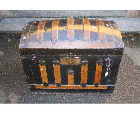 A late Victorian wood banded dome top trunk with fabric lining, 86cm wide