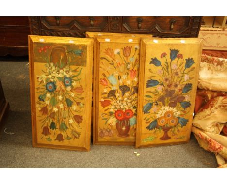 A set of four gilt ground architectural wall panels, each painted with sprays of flowers, 75 x 40cm