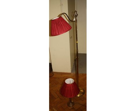 A gilt and tubular brass reading lamp with spreading foot and a brass table lamp