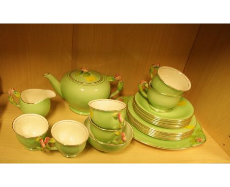 A circa 1930s Royal Winton apple green tea service, a six place setting with moulded pink rosebud decoration, printed mark