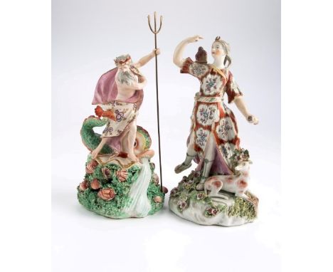 An 18th century Derby Patch figure of Neptune, standing with trident atop a water spewing dolphin on a shell encrusted base, 