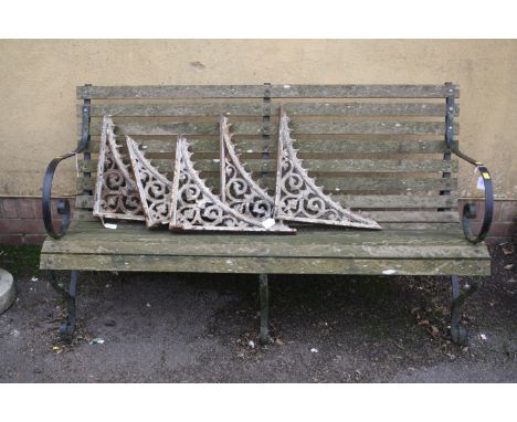 A vintage wrought iron scroll end three seater estate bench with replacement teak slats, 150cm wide