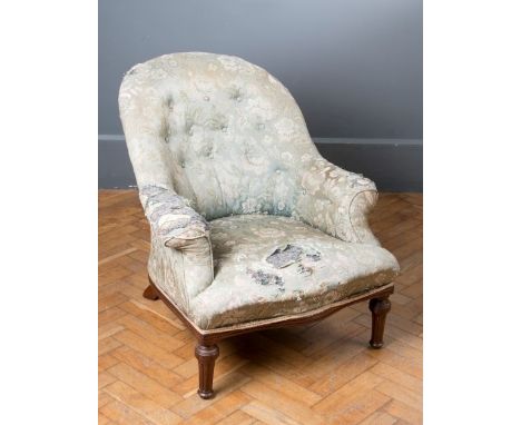 A Holland and Sons walnut framed lady's chair, with button upholstery and serpentine seat above turned front supports, the re
