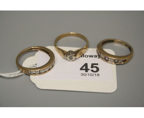 A single stone diamond ring, an amethyst and diamond half hoop eternity ring and one other