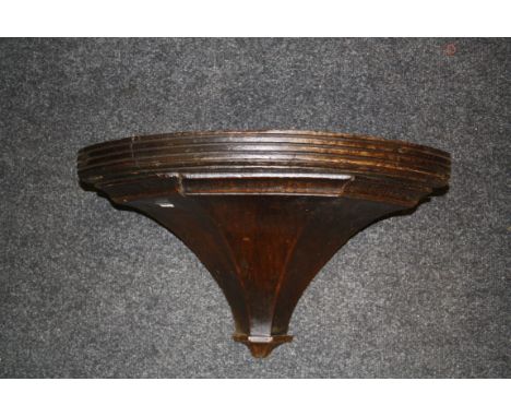 A Victorian oak fan corner bracket, with bow front, 51cm