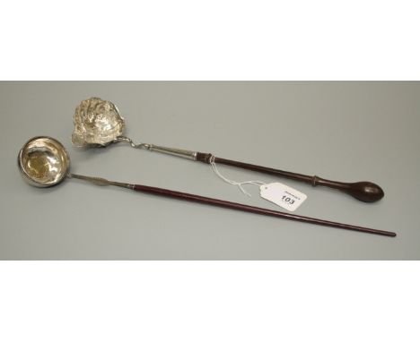 A George III silver toddy ladle, with florally cast bowl and turned wood handle, together with another set with a 'Piece of E