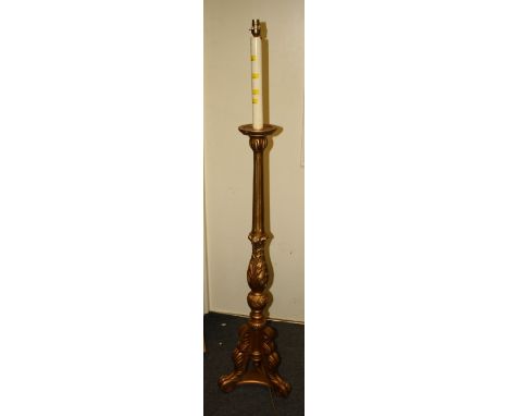 A carved and gilt standard lamp in th Italianate style