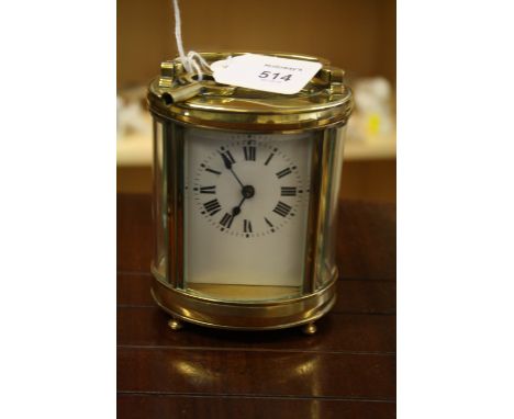 An early 20th century French brass five glass carriage timepiece, the elliptical case enclosing an eight-day movement with pl