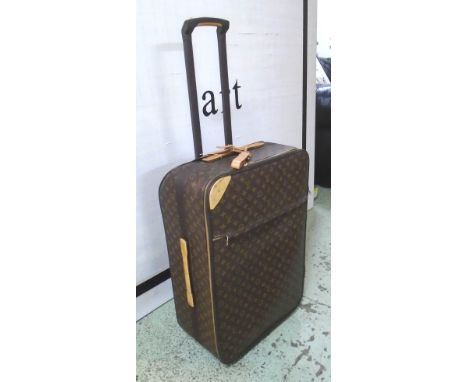 LOUIS VUITTON ROLL-ALONG SUITCASE, monogram pattern, approx 67cm. (purchased from Selfridges)