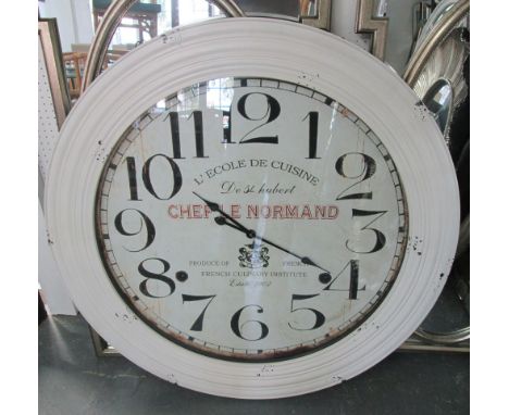 WALL CLOCK, circular in distressed white frame, 'Chef Le Normand' inscription, 100cm diam.