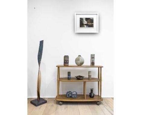 An Ercol pale elm three tier bookcase trolley, width 93cm.Condition report: The top and tiers are in a good condition some sm