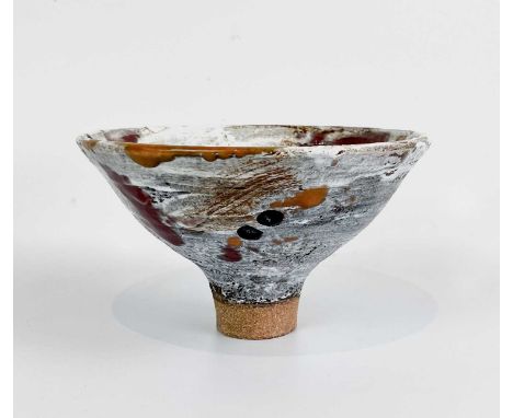Robin WELCH (1936-2019) A shino glazed footed bowl with red, orange black glaze drips, impressed potters seal, diameter 20cm.