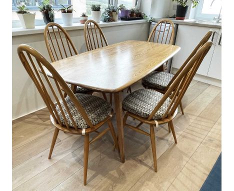 An Ercol pale elm dining table with set of six quaker chairs, length of table 152cm.Condition report: The table top is in a u