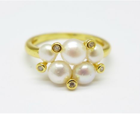 A silver gilt and freshwater pearl cluster ring, N 