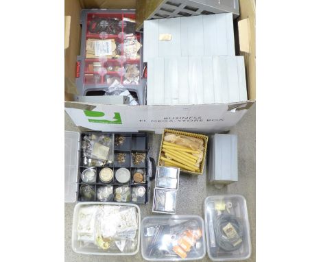 A large collection of watch parts, some tools and clock embellishments 