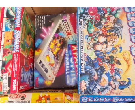 Four boxed games comprising Games Workshop Blood Bowl, Hot Wheels Rod Runner, Tomy Atomic Pinball and Screwball Sramble.