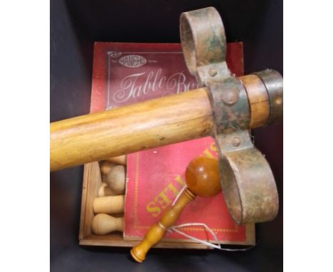 Vintage toys comprising a pogo stick, stick and ball, skillets and table bowls. 