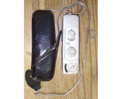 A Minox subminiature spy camera with leather case. 