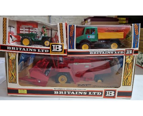 Three Britains diecast models comprising of a 9570 Combine Harvester, a 9569 Tractor Lorry &amp; a 9670 Dump Truck, all in or