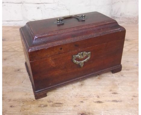 A George II mahogany tea caddy with brass handle and bracket feet. 