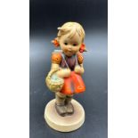 A West German Hummel Goebel figure of a school girl