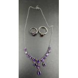 A small selection of costume jewellery set in silver to include an 'I am that I am ring' along