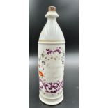 A late 19th Century French apothecary bottle, hand painted with a scrolling floral pattern