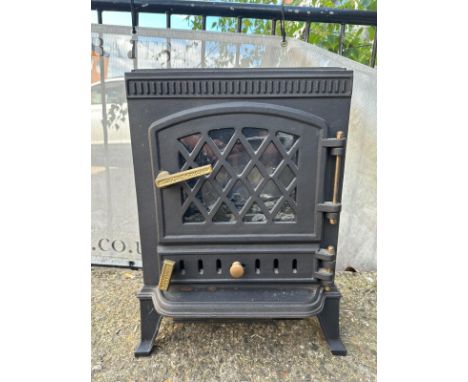 A cast iron electric fireplace in the form of a wood burning stove 