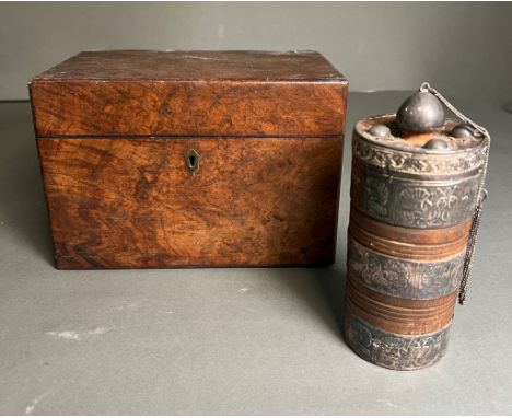A tea caddy along with a white metal lidded pot 