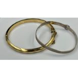 A rolled gold bracelet and a sterling silver christening style bracelet.