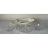 A collection of white ceramic plates and glass dishes