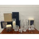 A selection of cut glass crystal including vases, candlesticks etc