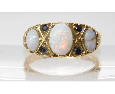 A 9ct gold opal and sapphire cluster ring, size M1/2, weight 3.4gms (one opal af) Condition Report:Available upon request