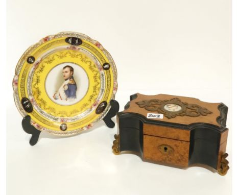 An ebonised and burr wood jewellery box with painted porcelain portrait panel, together with a Naples plate depicting Napoleo